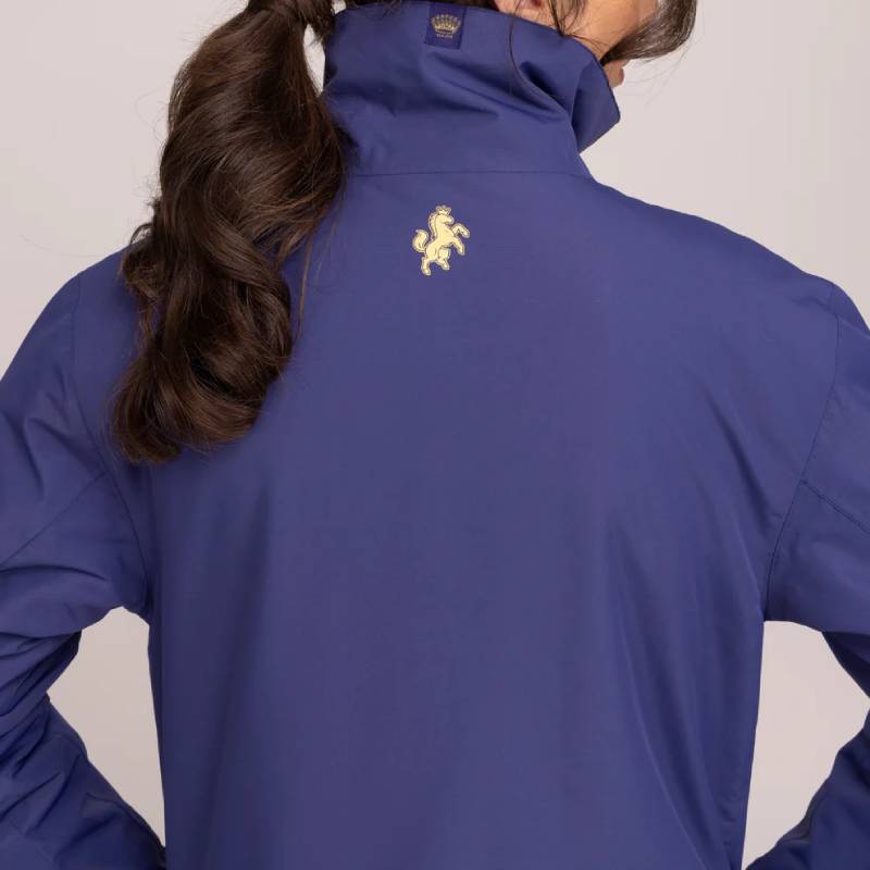 Woman with long brown hair wears the Aubrion Team Blouson Midnight jacket.