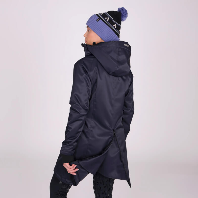 Person in a Shires Aubrion React Mid Length Coat Shadow and blue knit hat, back turned.