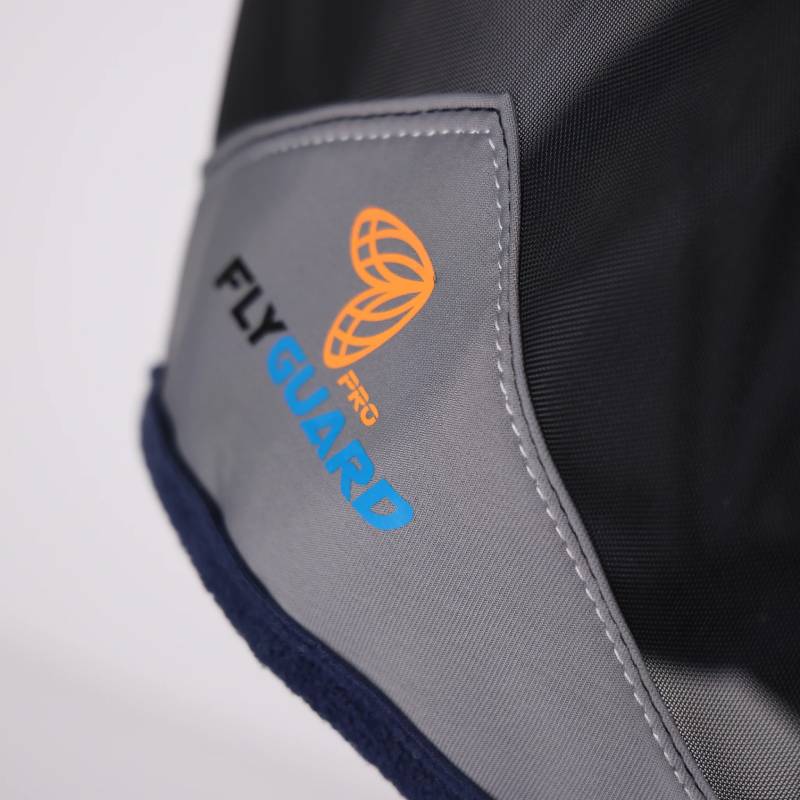 Close-up of a navy Shires FlyGuard Pro Fine Mesh Fly Mask with Ears fabric label.