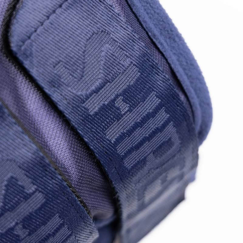 Close-up of Shires FlyGuard Pro Fine Mesh Fly Mask with Ears Navy strap showing embossed text.