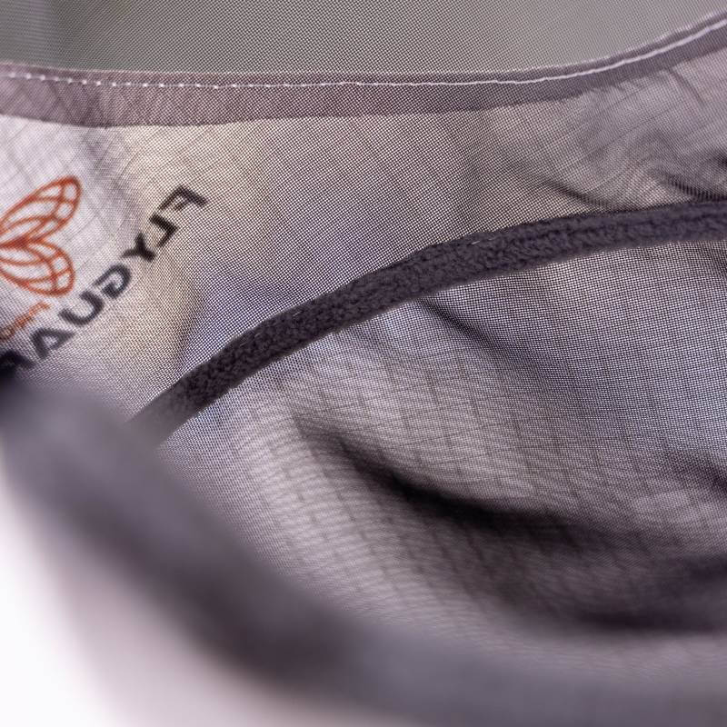 A horse wears the Shires FlyGuard Pro Sun Shade Fly Mask with Ears & Nose outdoors.