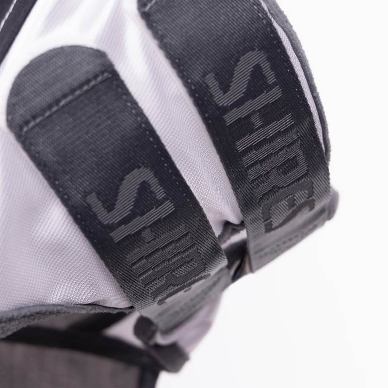 Close-up of Shires FlyGuard Pro Sun Shade Fly Mask with white straps and S-HIRE text.