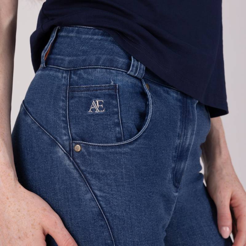 Wearing Aubrion Equestrian Jeans Denim and a navy shirt, AE embroidered on the front pocket.