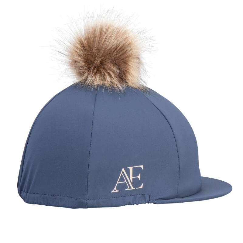 Aubrion Equestrian Hat Silk Midnight with brown faux fur pom and white AE logo on the side.