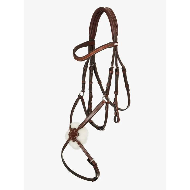 LeMieux Arika Grackle Bridle in Havana/Silver with white fleece noseband on white background.