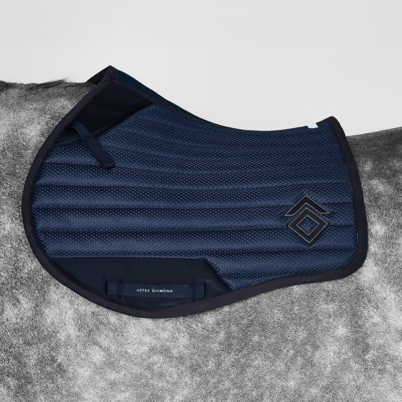 Aztec Diamond Mesh Saddle Cloth Jump Cut Navy on gray horse with jump saddle, white background.