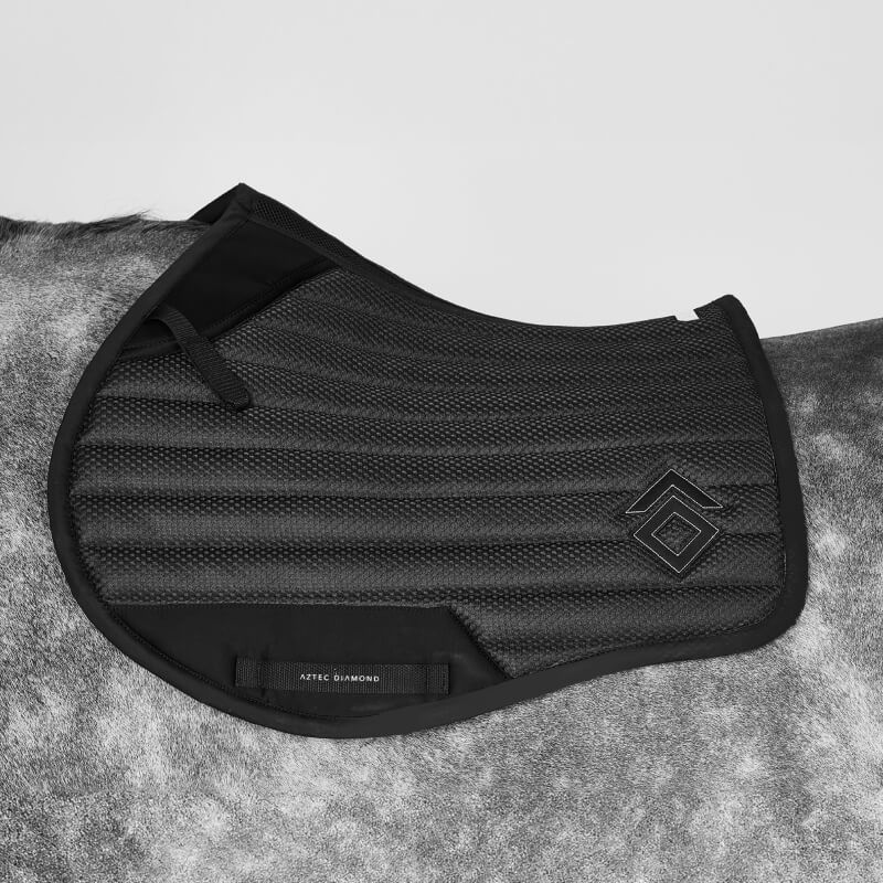 Aztec Diamond Mesh Saddle Cloth Jump Cut Black on gray horse, quilted with small logo.