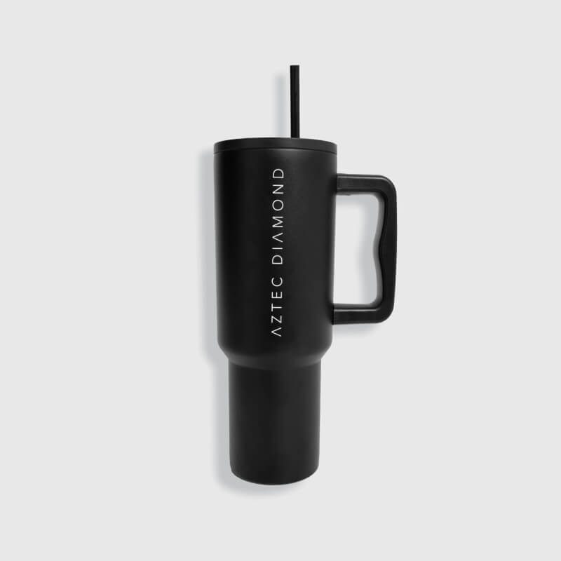 Aztec Diamond Tumbler Black by Aztec Diamond with handle, straw, and text on gray background.