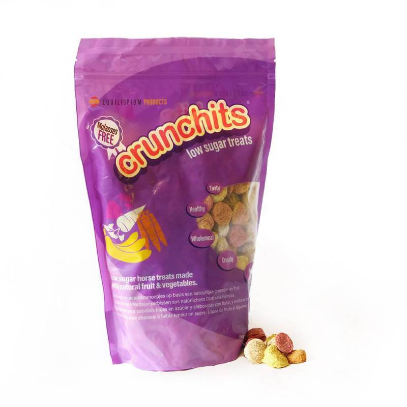 A purple pouch of Equilibrium Crunchits 750g with low sugar, laminitis-friendly treats beside it.