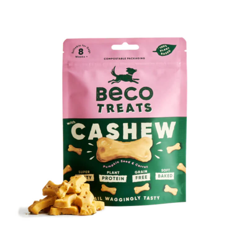 Pink and green Beco Cashew with Pumpkin Seed &amp; Carrot Dog Treats 70g bag with treats beside it.