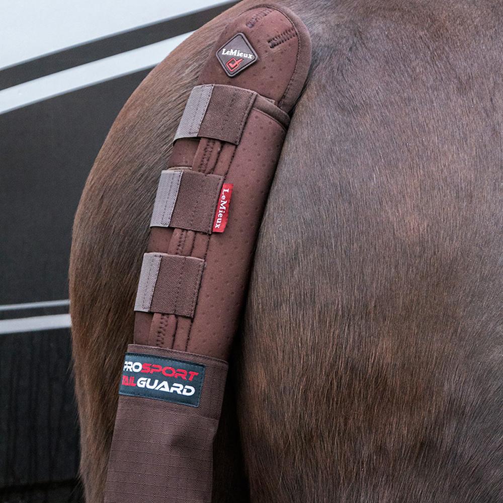 Brown horse with a LeMieux Tail Guard With Bag featuring velcro straps and brand labels.