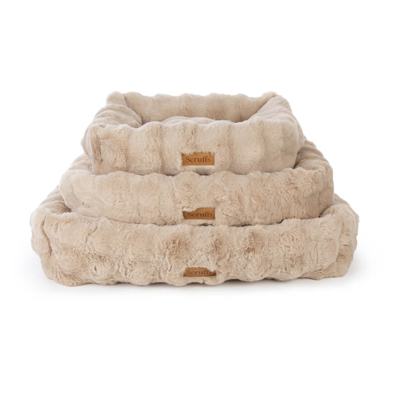 Three stacked Scruffs Alpine Box Beds in champagne faux fur, various sizes, on a white background.