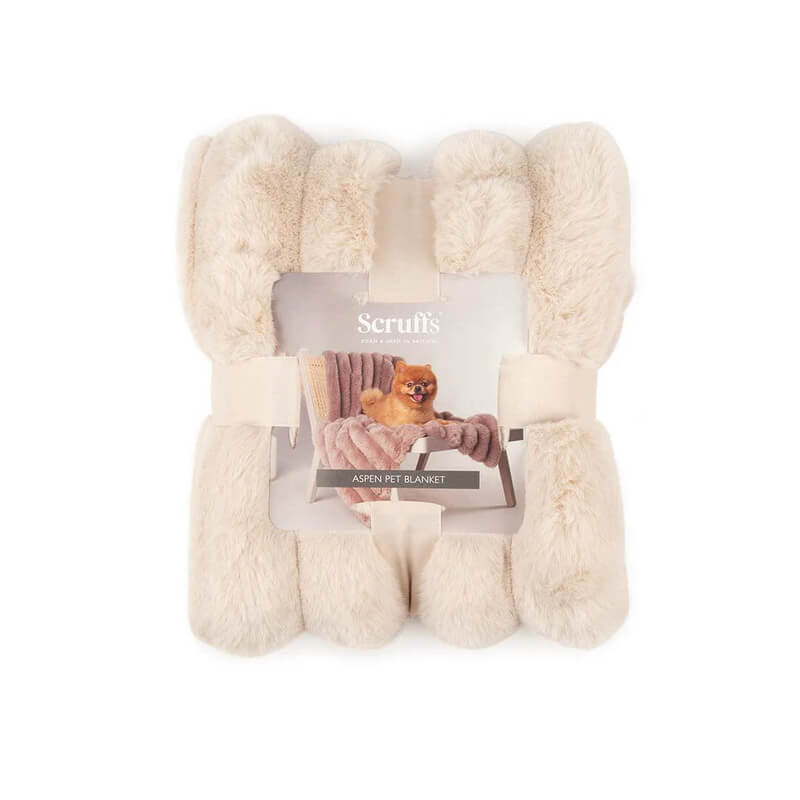 Scruffs Aspen Blanket 110x75cm Cream with packaging showing a dog on the faux fur blanket.
