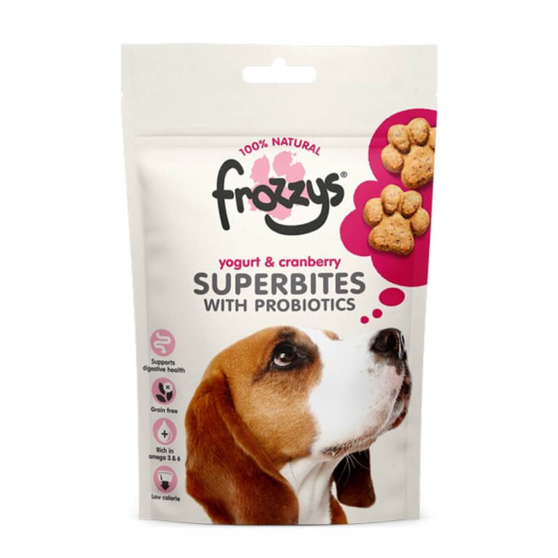 A dog looks up at a bag of Frozzys Superbites with Probiotics, Yogurt &amp; Cranberry 100g.