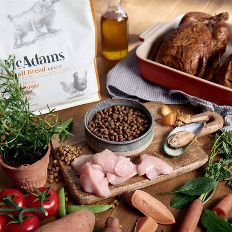 McAdams Dry Dog Food Small Breed Chicken by McAdams on a wooden table.