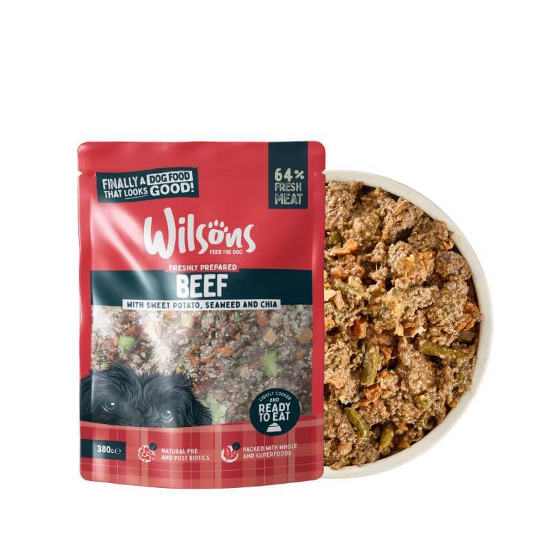 Wilsons Premium Fresh Dog Food Beef 380g with complete nutrition beside veggies and food.