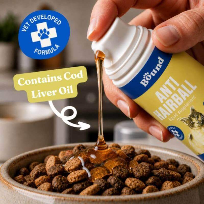 Hand pours Bound Pets Anti Hairball Liquid onto cat food; Bound Pets label is visible.