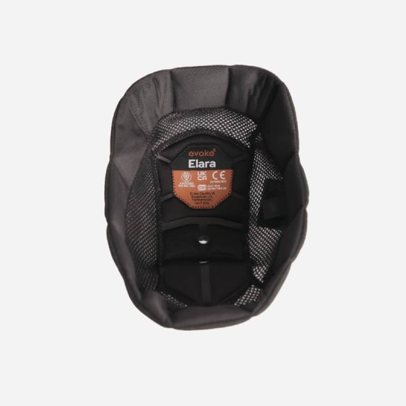 Evoke Elara black padded helmet liner with removable crown and orange safety certification label.