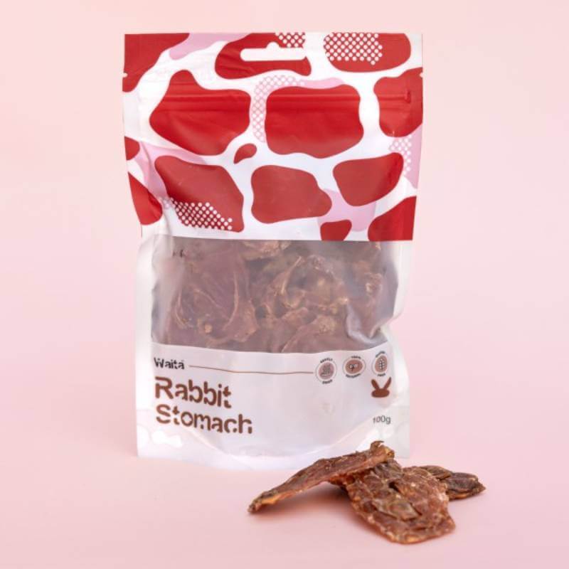 Waita Air Dried Rabbit Stomach Dog &amp; Cat 100g treat on a light pink background.