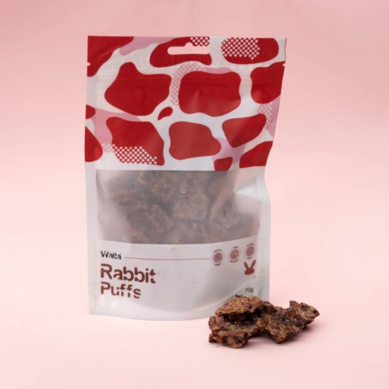 Waita Air Dried Rabbit Puffs Dog &amp; Cat 70g with puffs on a pink background.