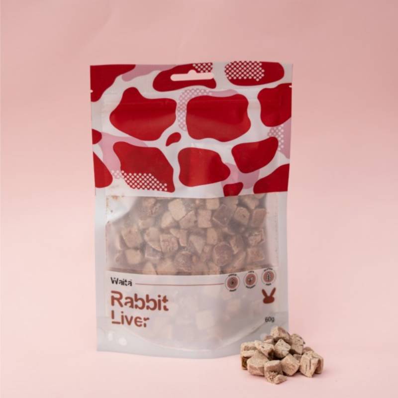 Waita Freeze Dried Rabbit Liver Dog &amp; Cat 60g treats, organ meat pieces on a pink surface.