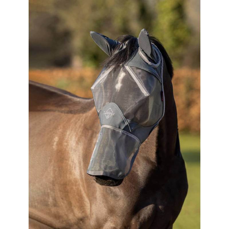 Brown horse wears LeMieux Armourshield Pro Full Fly Mask Grey with UV protection outdoors.