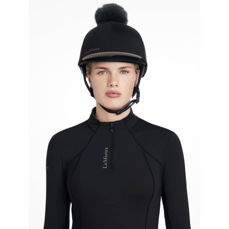 Person in a LeMieux Classique Pom Hat Silk Black, facing forward.