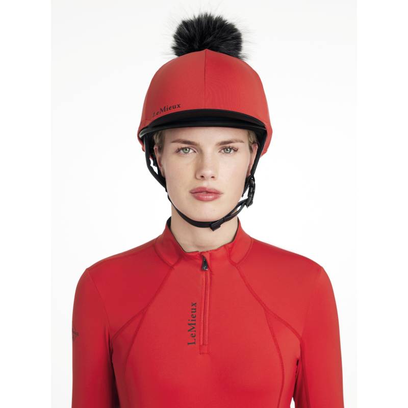 Woman in LeMieux Classique Pom Hat Silk Chilli, facing forward.