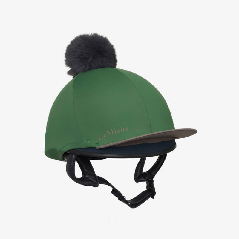 LeMieux Classique Pom Hat Silk Hunter Green with dark pom-pom and chin strap.