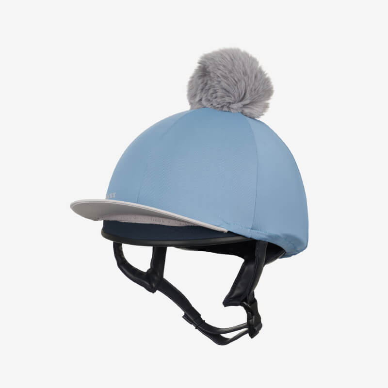 LeMieux Classique Pom Hat Silk Ice Blue with grey pom-pom and chin strap.