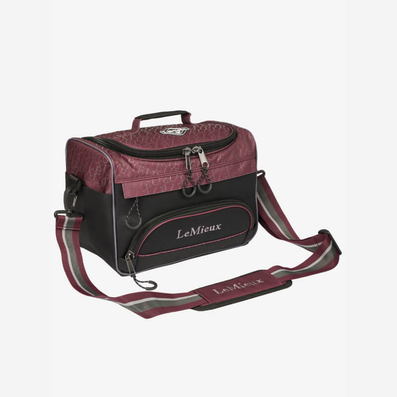 LeMieux Elite ProKit Lite Grooming Bag in Burgundy with adjustable strap and zippered pockets.