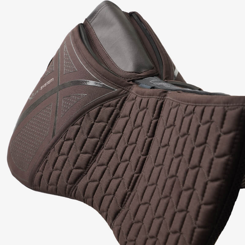Close-up of LeMieux ProSorb Plain 3 Pocket Quilted Half Pad Brown with foam shims for support.