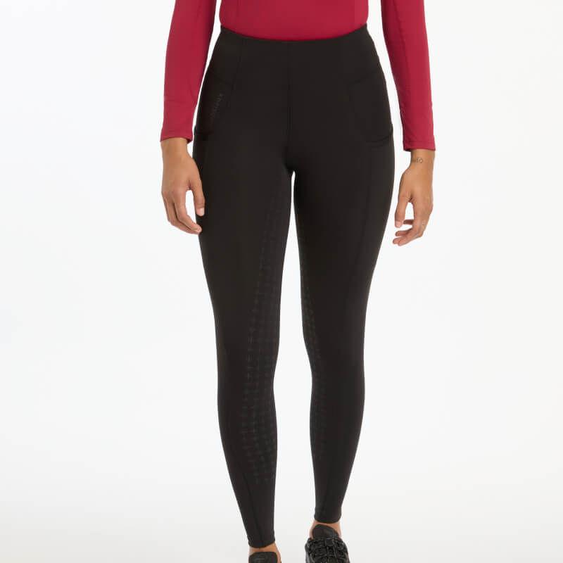 Wearing LeMieux Naomi Pull On Breeches Full Seat Black against a white background.