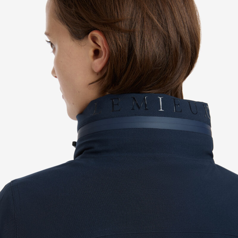 Woman in a LeMieux Ladies Team Jacket Navy with LeMieux branding on the collar.