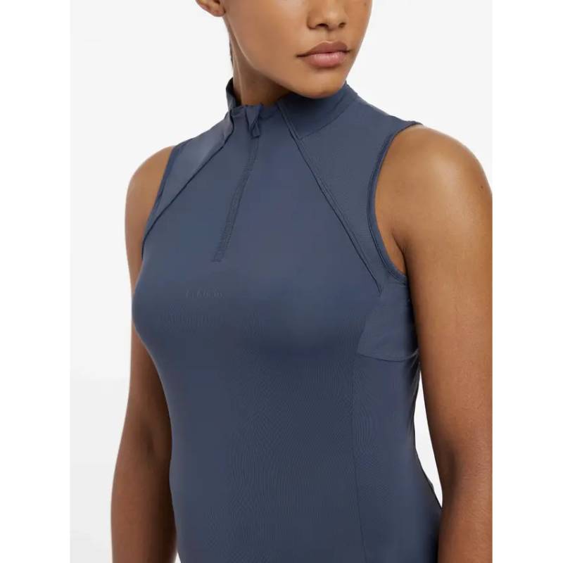 Woman in LeMieux Maria Mesh Sleeveless Baselayer Dusk Blue, UV50+ fabric.