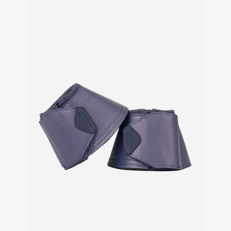LeMieux Arika Over Reach Boots Dusk with PU leather and Velcro, stacked on white background.