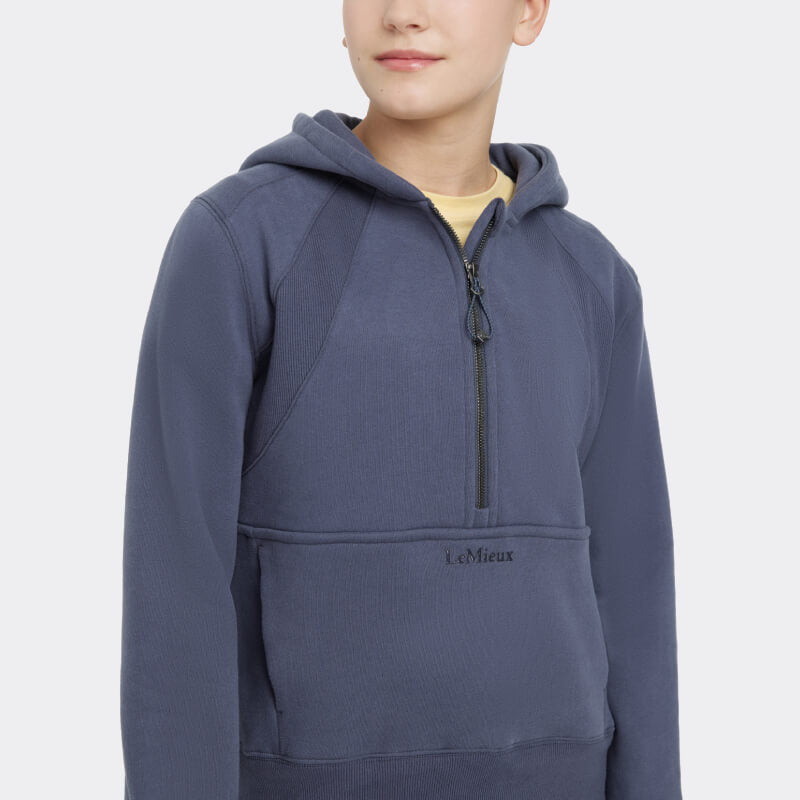 LeMieux Young Rider Harriet Pop Over Dusk hoodie in blue with LeMieux logo on the pocket.