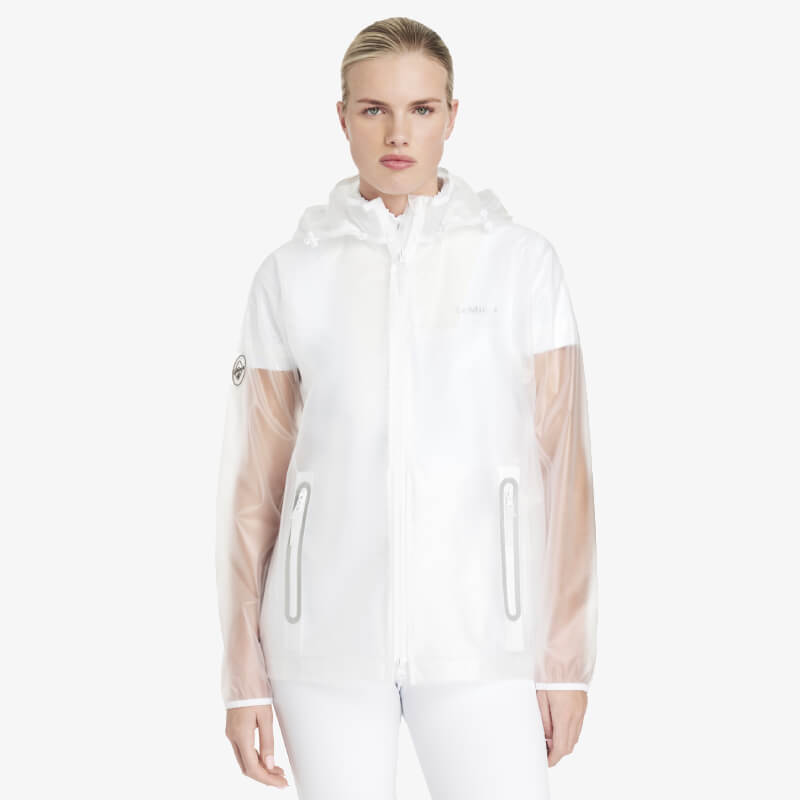 Wearing a LeMieux Competition Waterproof Jacket Clear with mesh sleeves and white pants.