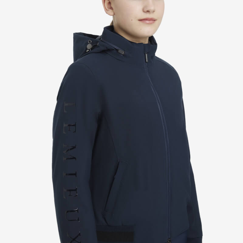 Person wearing LeMieux Young Rider Team Jacket Navy by LeMieux, facing forward.
