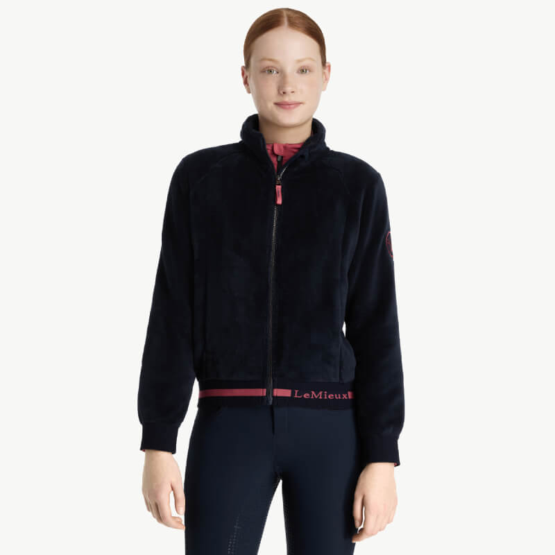 LeMieux Young Rider Libby Fleece Navy zip-up jacket, shown worn by a female model.