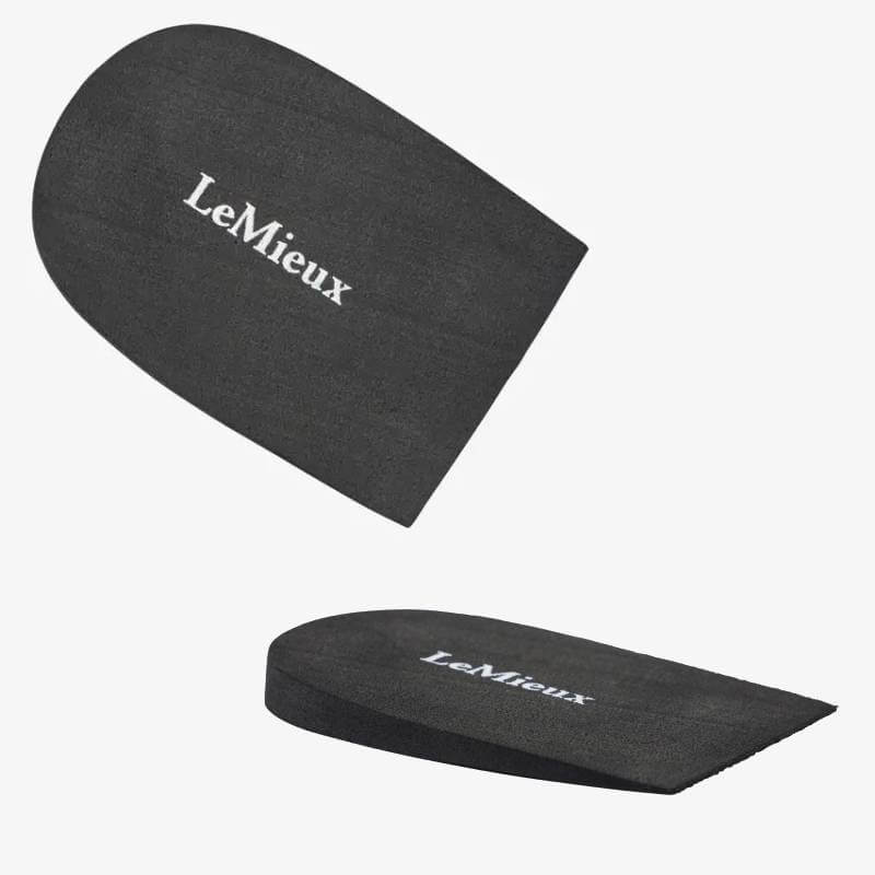 Two black LeMieux Heel Risers, shown flat and angled to display thickness for boot fit.