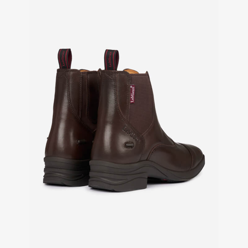 LeMieux Junior Zip Paddock Boot in brown, shown from the back with pull tabs.
