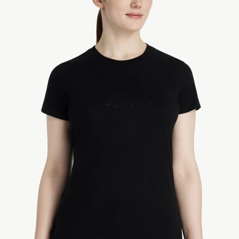 Woman in LeMieux Classique Sparkle Black T-Shirt stands against a plain white background.