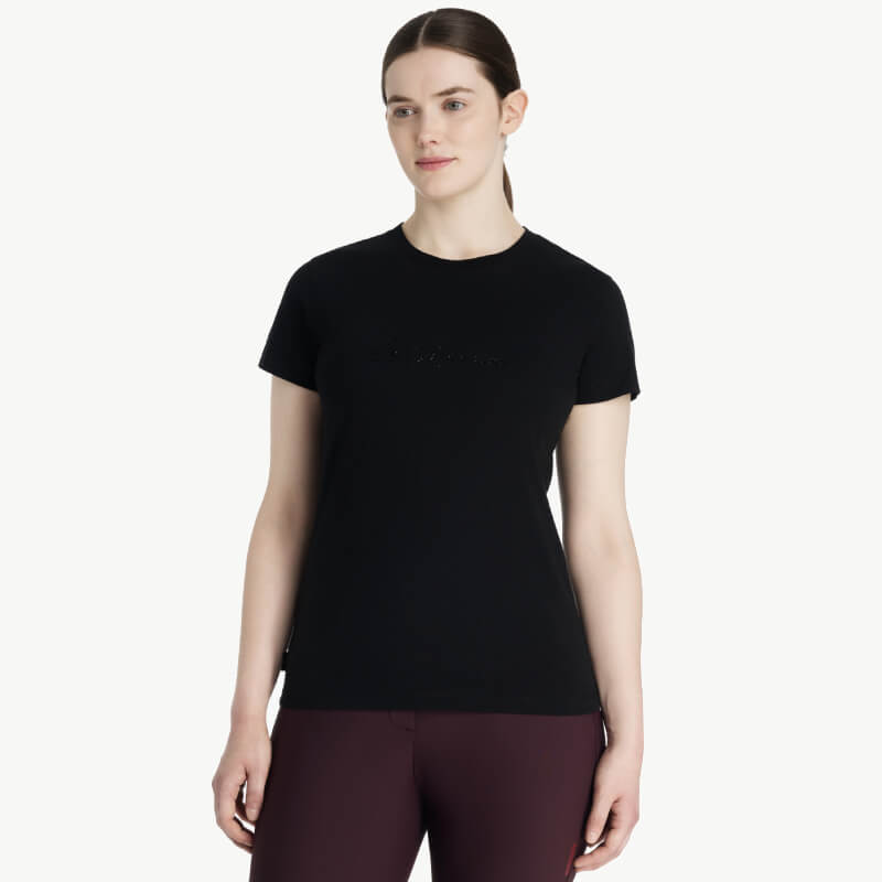 Woman in LeMieux Classique Sparkle Black T-Shirt stands against a plain white background.