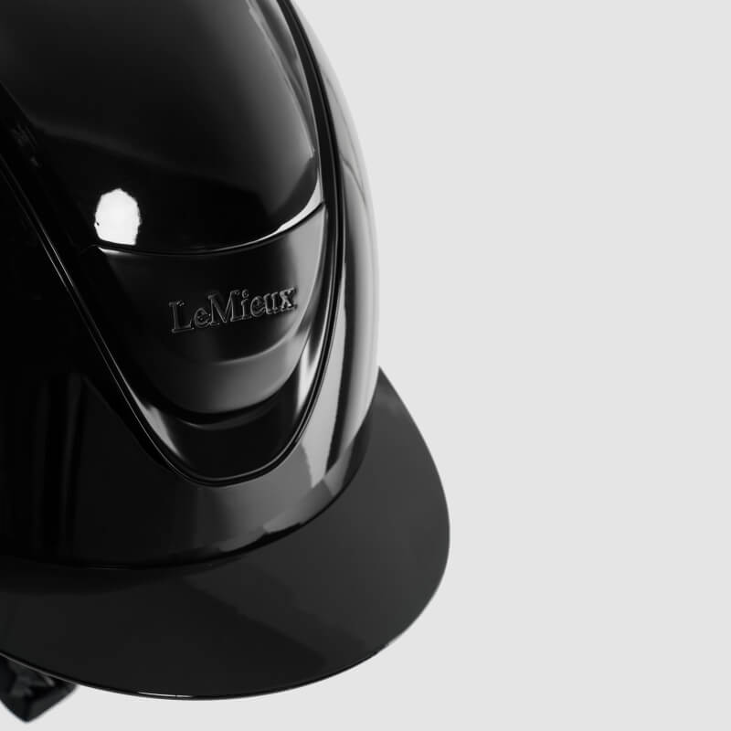 LeMieux Verv® Competition Helmet Gloss Black with LeMieux logo on light gray background.