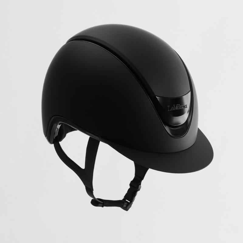 LeMieux Verv® Matte Black helmet offers impact protection with chin strap against a white background.