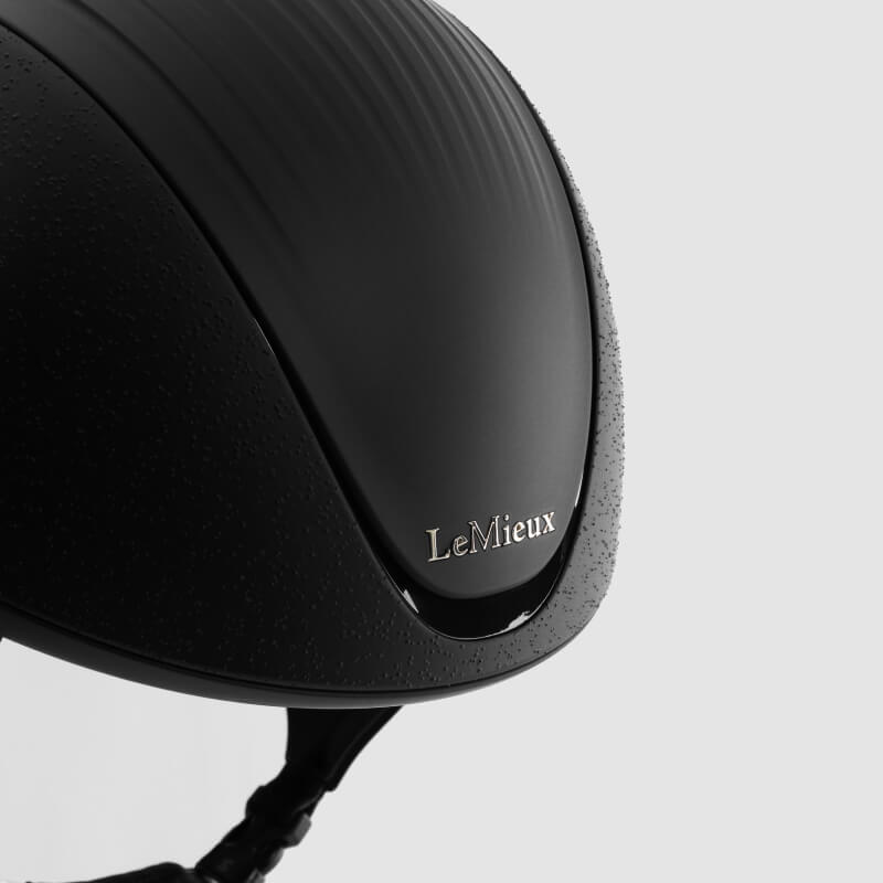LeMieux Vexa® Skull Helmet Black with chin strap, shown against a plain white background.