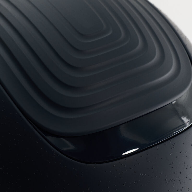 Close-up of the LeMieux Vexa® Skull Helmet in navy with glossy, ridged design.