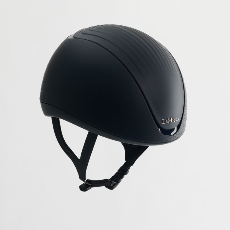 A navy LeMieux Vexa® Skull Helmet with chin straps, designed for equestrian safety.