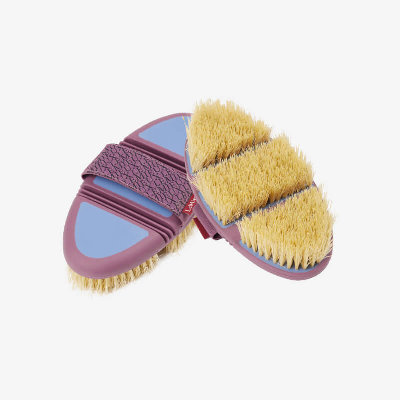 LeMieux Flexi Scrubbing Brush Powder Blue with tan bristles and fabric strap.